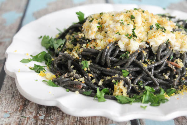 squid ink spaghetti with buttered crab and gremolata breadcrumbs